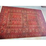 Louis de Poortere Mossoul wool carpet, the terracotta red field with four sections containing