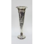 Large Edwardian silver vase, with repousee floral pattern, flared rim and weighted circular base,
