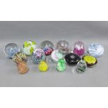 Collection of fifteen glass paperweights to include Caithness, Selkirk and Pfeiffer, etc and a Kosta