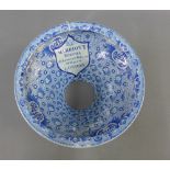19th century Staffordshire blue and white lavatory bowl, transfer printed with flowers, cartouche