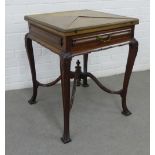 Envelope games table with a single drawer and raised on carved cabriole legs,