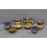 Five copper lustre jugs and one bowl, (6)