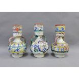 Set of three Middle Eastern style stoneware handles, painted with blue, yellow and green pattern,