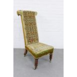 Tapestry upholstered prie dieu chair, on turned wooden legs with brass caps and castors, 50 x 102cm