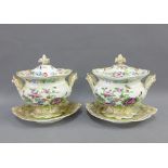 Pair of 19th century Staffordshire floral patterned sauce tureens with stands, 18cm wide, (2)