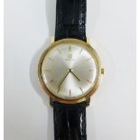 Gents 9ct gold cased Omega wrist watch, with champagne dial and hour baton markers, on a black