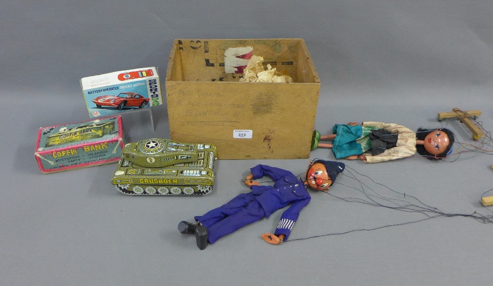 Two vintage Pelham puppets to include a Policeman, together with a Mechanical wind up Mystery