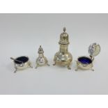 Four-piece silver cruet set by Harrods, Ltd, London 1965 / 66, comprising sugar castor, pepper