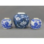 Chinese blue and white prunus jar and a pair of Chinese blue and white jars, tallest 15cm (3)