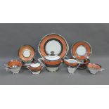 Early 20th century orange glazed teaset with silver lustre rims, (a lot)