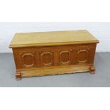 Contemporary light oak blanket box with carved front panel and metals side handles, 54 x 122 x 62cm