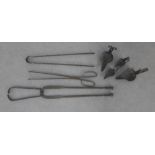 Collection of iron items to include tongs, rush light holders, etc (a lot)