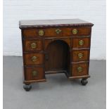 18th century mahogany and walnut veneered kneehole desk, the rectangular top with wavy rim, over