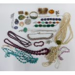 A quantity of costume jewellery to include faux pearls, coloured beads, bracelets, earrings and