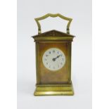 French brass and glass panelled carriage clock with a white enamelled dial and Arabic numerals, (a/f