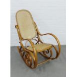 Bentwood rocking armchair, with canework back and seat, 104 x 54cm