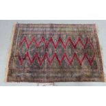 Easter rug with red zig zag pattern within multiple geometric borders, 186 x 128cm