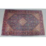 Persian Feraghan rug, with red and blue foliate field, 201 x 128cm