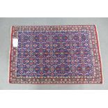 Persian Varamin rug with a blue foliate field, 156 x 104cm