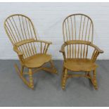 Two Windsor style pine rocking chairs with hoop comb backs, solid saddle seats and sleigh style