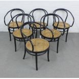 Set of six ebonised Bentwood open arm chairs, with circular canework seats (one sagging) 82 x
