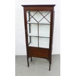 Edwardian mahogany display cabinet with glazed panels and shelves, over fretwork and square legs,