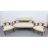 Edwardian three-piece parlour suite with cream upholstered backs, arms and seats and carved mahogany