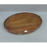 19th century mahogany oval tray with brass handles, 76 x 57cm (2)