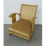 Early 20th century oak low chair with Bergere cane back and upholstered seat, 60 x 70cm