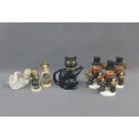 Five Hummel figures, bisque pottery piano baby and a black cat teapot, (7)