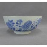 Chinese blue and white punch bowl with floral pattern and circular footrim, 26cm diameter (a/f)