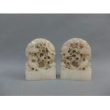 Two soapstone cared floral plaques, 13cm high (2)