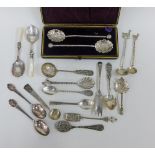 A collection of souvenir teaspoons, a pair of Epns berry spoons and a pair of mother of pearl