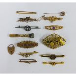 A collection of ten brooches, five of which are stamped 9ct, 9ct gold heart padlock, yellow metal