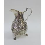 Victorian silver gilt cream jug, H,J Lias & Son, London 1872, with embossed flower and scrolling