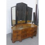 Whytcok & Reid walnut dressing table, with triple mirror over an arrangement of eight drawers, on