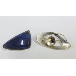Two mid century Swedish silver brooches, one with blue polished agate, circa 1961 the other with
