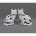 A pair of blue and white pottery cats, 27cm (2)