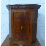 Small mahogany and chequer banded corner wall cupboard with an inlaid shell paterae and shelved