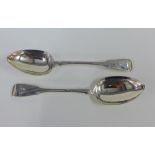 A pair of George III silver Fiddle pattern serving spoons, London 1810 , each with an engraved