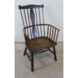 Elm Windsor chair with a shaped top rails, combed back and solid seat, turned legs untied by a