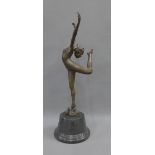 Bronze Art Deco style dancer and serpent figure, on a circular hardstone base, 57cm high