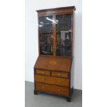 19th century mahogany and inlaid bureau bookcase, the dentil frieze above a pair of glazed doors ,