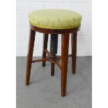 Adjustable piano stool with a circular seat and tapering legs, 34 x 50cm