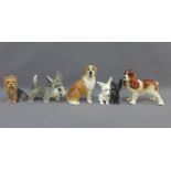 A collection of 20th century pottery dogs to include Sylvac, etc (5)