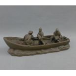 Bronze patinated resin figure of a fishing boat and fishermen, 28cm long