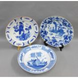 Three Delft chargers / shallow bowls, (fritting and losses), largest 35cm (3)