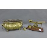 Set of brass postal scales on a mahognay base, oval brass planter and brass bell, (3)