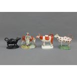 Three 19th century cow creamers to include Jackfield, etc and a Staffordshire cow and figure