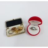 Gents 9ct gold signet ring, a pair of gold plated cufflinks, a silver celtic band ring and a white